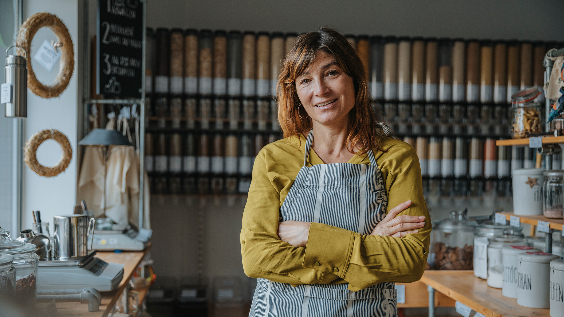 Business owner standing in her shop