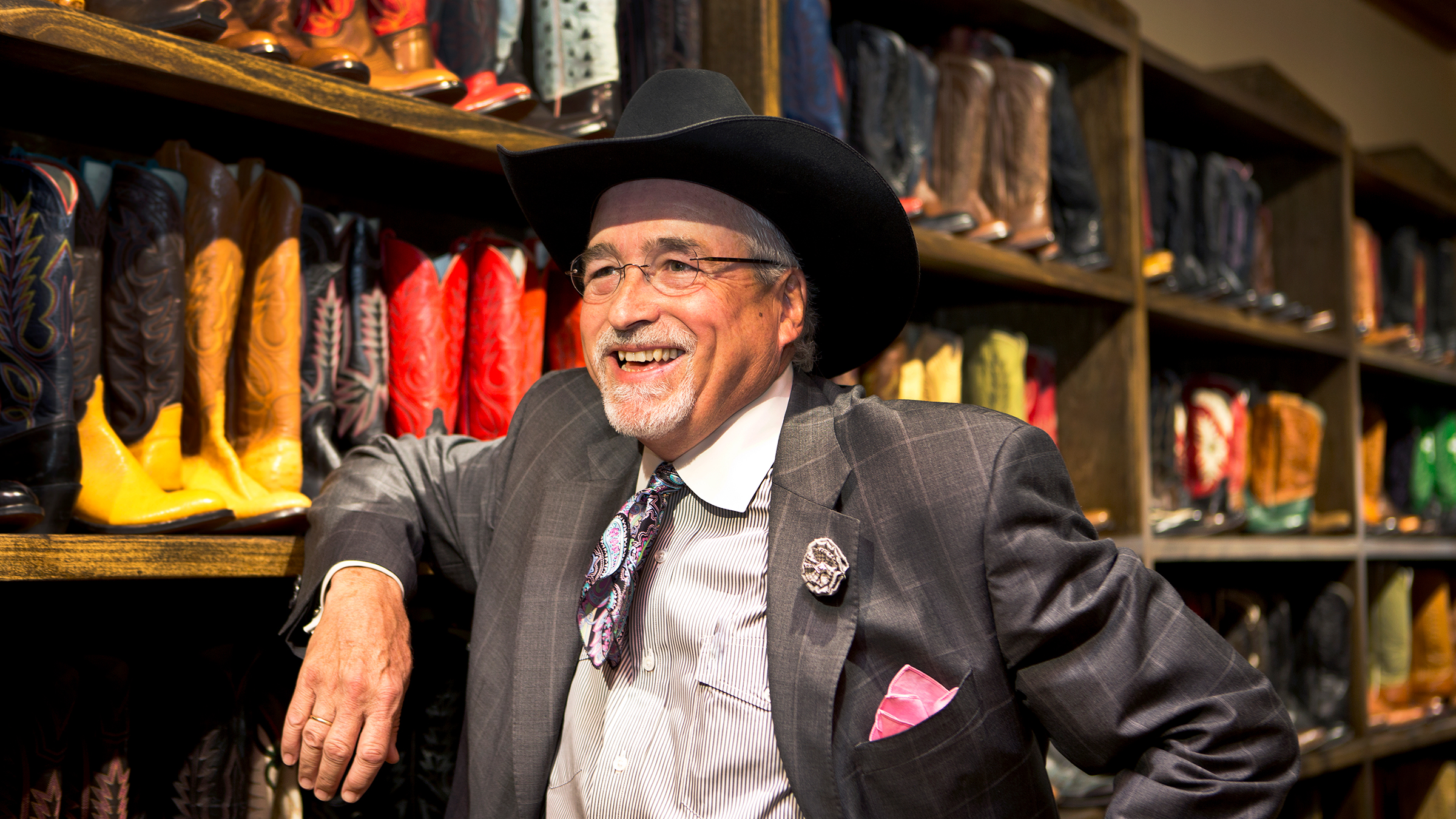 Man in suit with cowboy boots