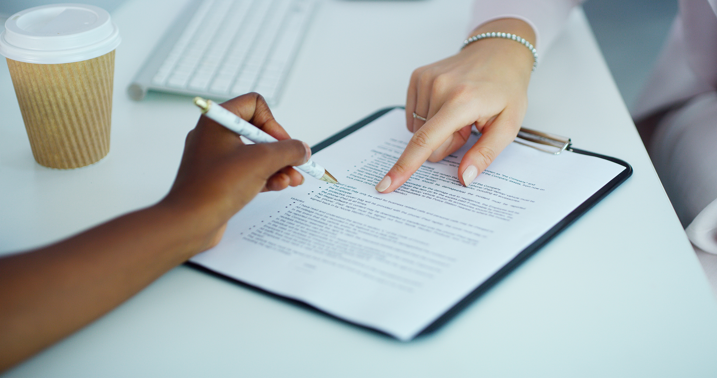 close up of hands and paperwork