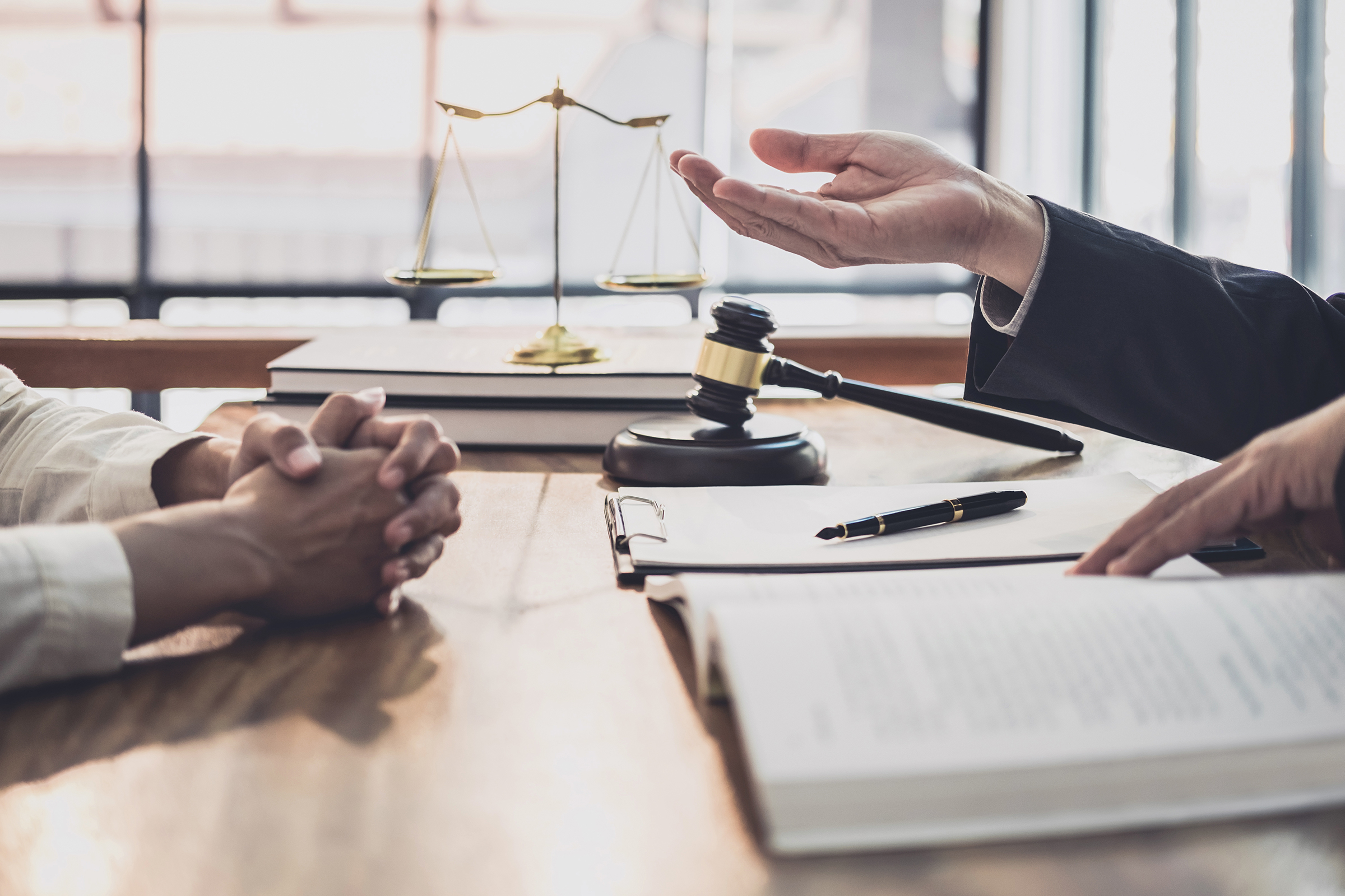 Male lawyer or judge consult having team meeting with Businesswoman client