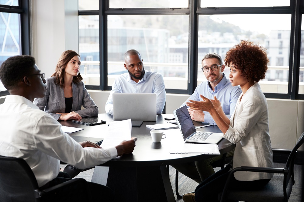 Group of employees having a discussion during a meeting