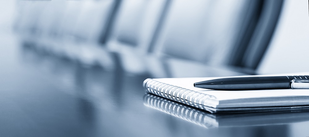 Notepad on a table with pen before meeting