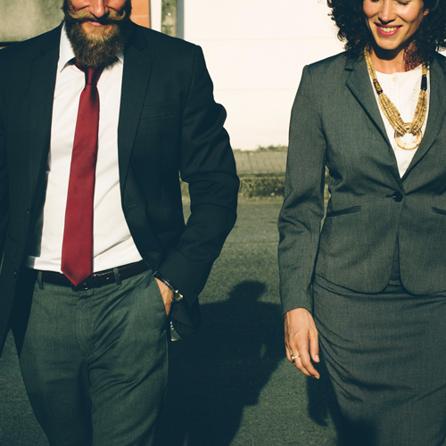 Business man and woman walking together